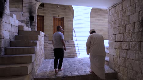 The-Spiritual-Council-Leader-walking-the-grounds-of-the-Yazidi-Temple-complex-in-Lalish,-Kurdistan-Iraq