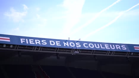 Fiers-de-Nos-Coleurs-sign-or-proud-of-our-colors-at-Parc-de-Princes-soccer-stadium-home-of-Paris-Saint-Germain,-Close-up-shot