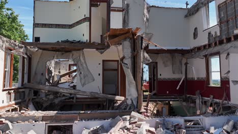 Torn-Down-house-in-american-neighborhood-during-sunny-day