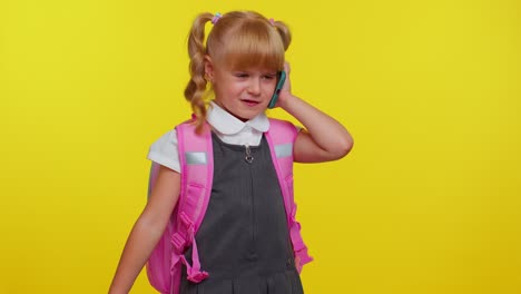 Dissatisfied-nervous-irritated-schoolgirl-making-a-call-with-mobile-phone-to-mother,-family-quarrel