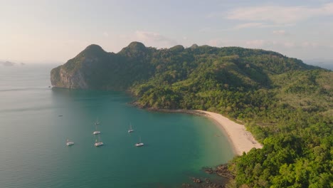 4K-aerial-drone-footage-of-Thailand-bay,-beach-and-rocks,-Koh-Mook,-Ko-Muk,-boats,-Asia