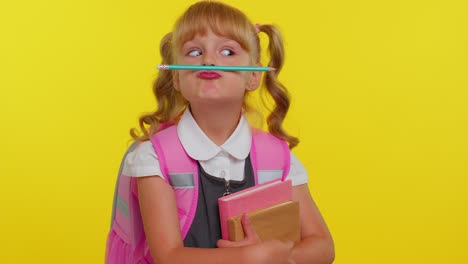 Funny-cute-kid-primary-school-girl-making-playful-silly-facial-expressions-fooling-around-with-pen