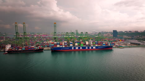 Mega-ship-CMA-CGA-full-of-containers-at-Pasir-Panjang,-Port-of-Singapore