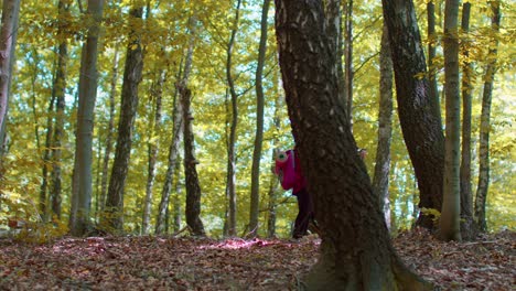 Senior-old-grandparents-tourists-man-woman-training-Nordic-walking-and-talking-in-forest-mountains