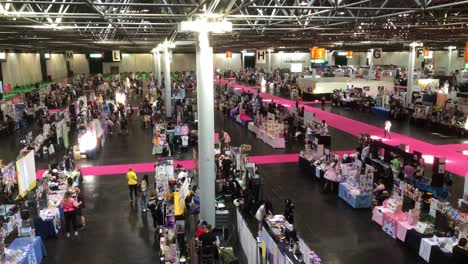 Static-shot-showing-Artists-and-creatives-set-up-their-stalls-for-the-Dokomi-event-in-Dusseldorf,-Germany,-29