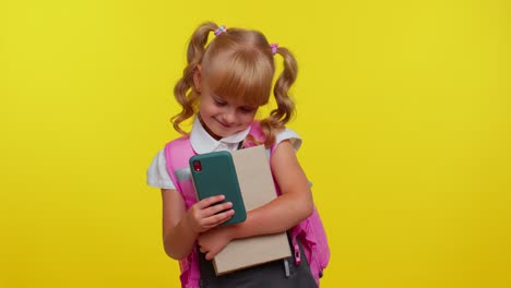 Funny-kid-blogger-primary-school-girl-taking-selfie-on-mobile-phone,-communicating-video-call-online