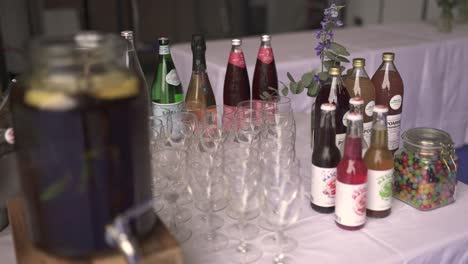 Candy-and-flavored-drinks-with-fruit-wine-at-an-event-table,-Close-up-shot