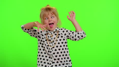 Funny-child-kid-girl-making-playful-silly-facial-expressions-and-grimacing,-fooling,-showing-tongue