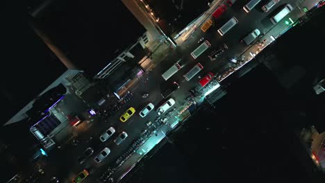 Rotating-top-shot-of-busy-traffic-at-Patong-Beach-at-Phuket,-Thailand-during-nighttime