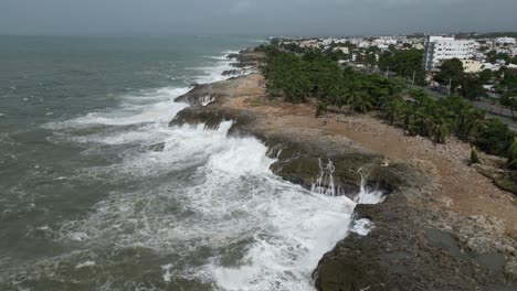 Waterfront-Malecon-coastal-promenade-of-Santo-Domingo-and-waves-crashing-after-hurricane-Beryl,-Dominican-Republic