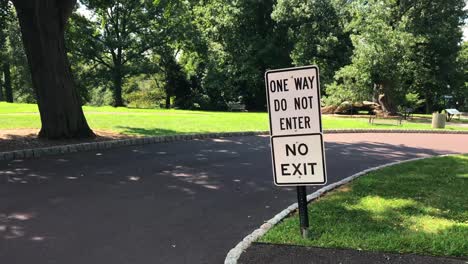 One-Way,-Do-Not-Enter,-No-Exit-signs-in-a-park