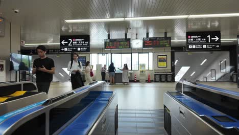 POV-tapping-IC-card-to-exit-metro-train-station-in-Japan