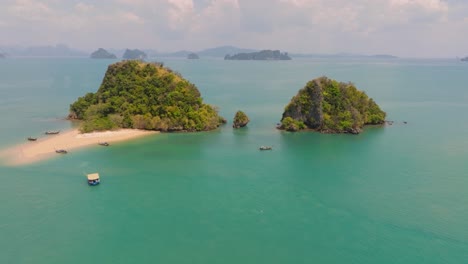 4K-aerial-drone-footage-of-Thai-islands-with-beach-and-long-tail-boats,-Thailand,-Asia,-Ko-Nok,-Nok-island