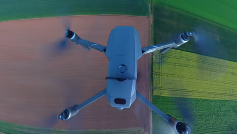 Drone-in-Flight-Over-Colorful-Fields,-Third-Person-View