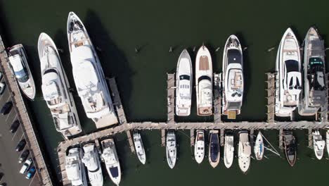 Superyachts-in-the-Hamptons,-Sag-Harbor-Yacht-Club,-Long-Island-New-York,-4K-aerial-overhead