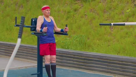 Senior-man-grandfather-80-years-old-training-sport-abs-workout-exercising-cardio-on-playground