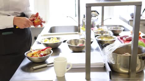 Restaurant-kitchen-staff-working-inside-and-preparing-the-food