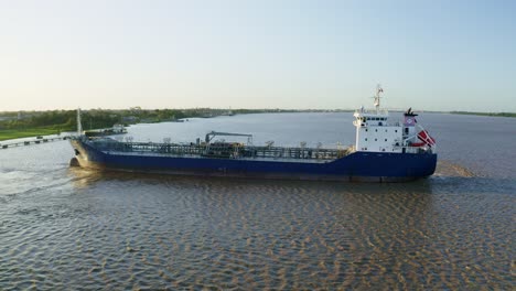 Aerial:-Oil-tanker-ship-getting-in-place-to-dock-in-Suriname-river