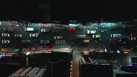 Top-shot-of-taxis-and-personal-cars-in-traffic-beside-Patong-beach-at-nighttime-in-Phuket,-Thailand