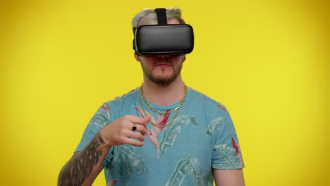 Man-using-virtual-reality-futuristic-technology-VR-headset-helmet-to-play-simulation-3D-video-game