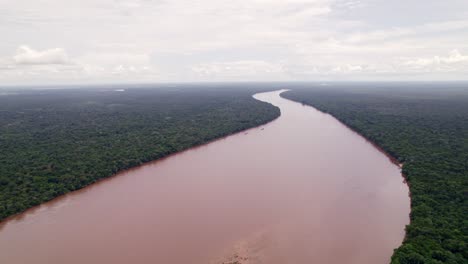 Aerial:-Large-fresh-water-river-going-through-thick-amazon-rain-forest,-Suriname-river