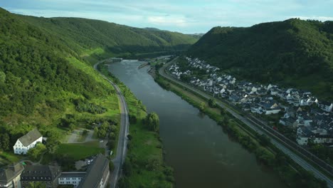 Flying-backwards-with-a-drone-over-the-Moselle,-a-beautiful-river-in-Germany