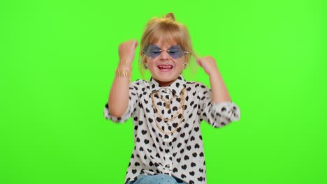 Portrait-of-funny-blonde-kid-child-shouting,-raising-hands-in-gesture-I-did-it,-celebrating-success