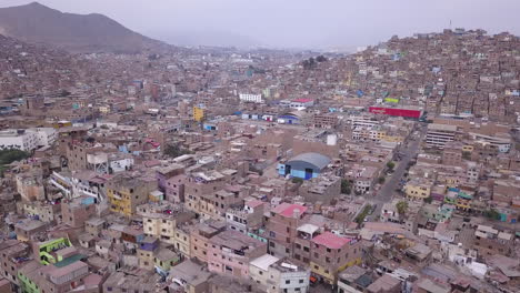 Dense-urban-landscape-with-tightly-packed-buildings-and-houses-on-a-hillside,-showcasing-a-sprawling-city