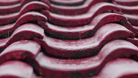 Raindrops-Falling-On-Red-Roof-Tiles-Of-Rooftop-On-Rainy-Weather,-Close-Up