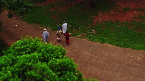 Aerial-view-of-people-walking-around-the-path-in-a-beautiful-green-park-in-Abuja,-Nigeria