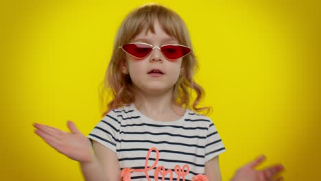 Little-teen-kid-child-girl-in-stylish-sunglasses-listening-music,-dancing-disco,-fooling,-having-fun