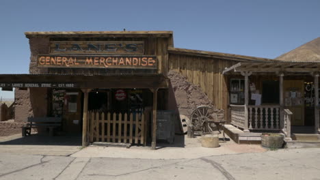 Rustic-storefront-facade,-general-store-and-gift-shop,-Calico-Ghost-Town,-California,-tracking-left-to-right