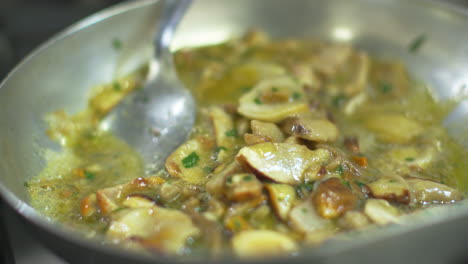 Cooking-tasty-and-juicy-mushrooms-in-a-pan-|-Slow-motion-close-up