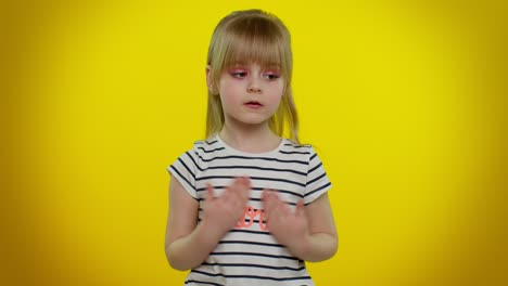 Funny-playful-blonde-kid-child-listening-music,-smiling-dancing-to-disco-music,-moving-her-hands