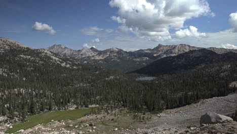 Wide-landscape-view-of-Sawtooth-Wilderness-mountains-with-forest-and-lake