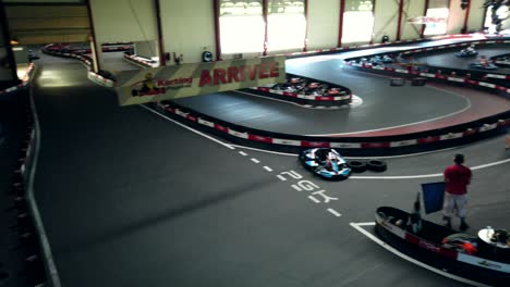 View-from-above-of-a-Go-kart-racing-track-with-people-having-fun-racing