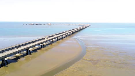 Drone-Aerial-View-of-Industrial-Oil-Pier-on-Coast-of-North-Sea,-Germany