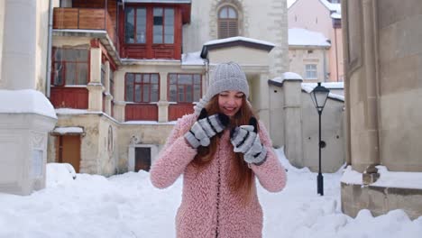 Woman-traveller-in-winter-city-reading-online-sms-mobile-phone-winning-prize,-dancing,-celebrating