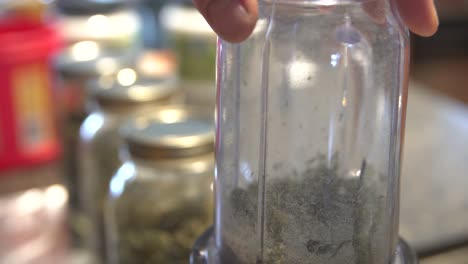 Legal-Medical-Cannabis-Herb-Ground-Finely-In-Food-Processor---Slow-motion-shot