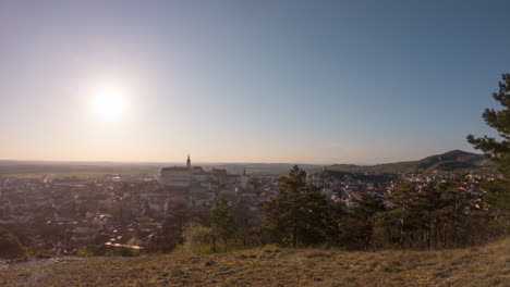 time-lapse-of-a-sunset-above-South-Moravian-village-Mikulov,-Czechia