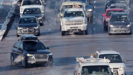 Lanes-of-vehicles-turn-at-an-icy-intersection-on-very-cold-winter-day