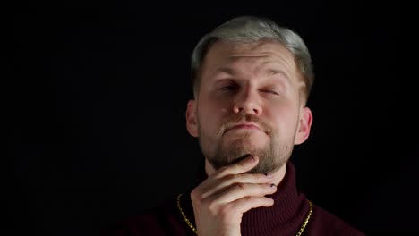 Thinking-man-looking-around-thinks-scratches-at-temple-comes-up-with-ideas-raised-finger-up