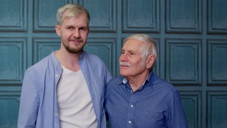 Happy-different-male-generations-family-of-senior-father-and-adult-son-or-grandson-showing-thumbs-up