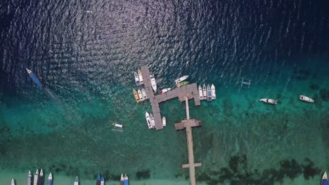 Aerial-top-view-of-boats-and-yachts-moored-in-a-pier-in-Bali