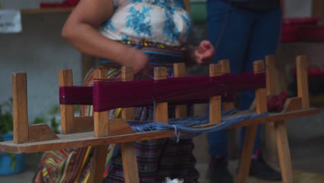 Guatemalan-Woman-Separates-Yarn-with-Old-Wooden-Tool