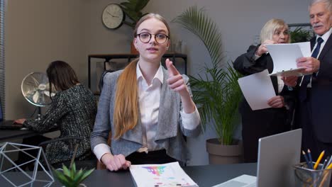 Young-adult-business-woman-pointing-to-camera,-choosing-lucky-one-winner,-meaning-we-need-you