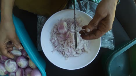 Woman-Slicing-Onions-On-Traditional-Vegetable-Cutter