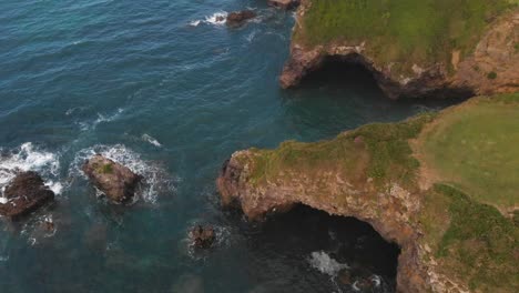 Cliffs-and-ocean-landscape,-aerial-high-angle