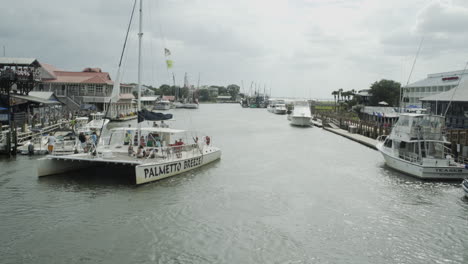 Catamaran-Boat-Docking-on-Shem-Creek,-South-Carolina,-Wide,-Static