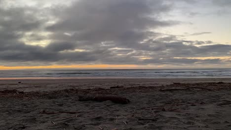 Time-lapse-at-sunset-of-clouds-and-waves-on-the-Oregon-coast